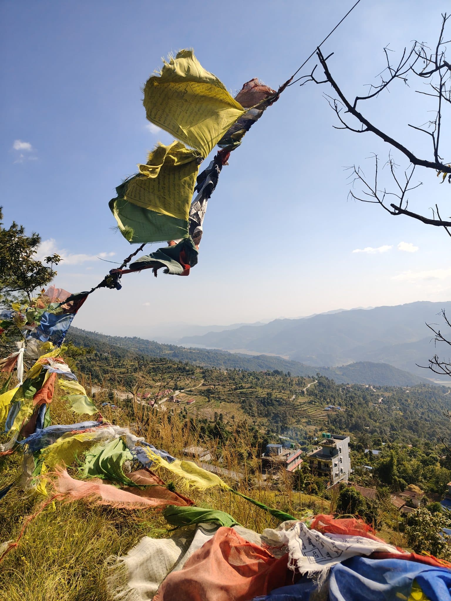 Prayer flags above a peaceful mountain valley in Nepal